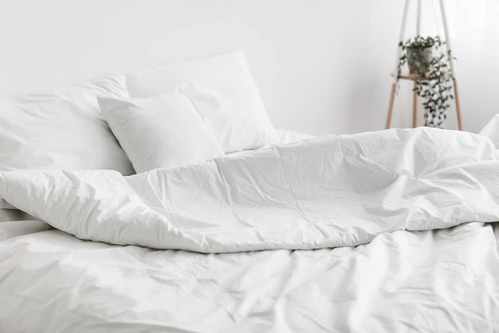 bed with white linens