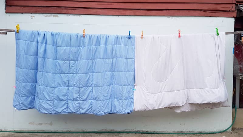 Hanging blanket outdoor for making it dry.