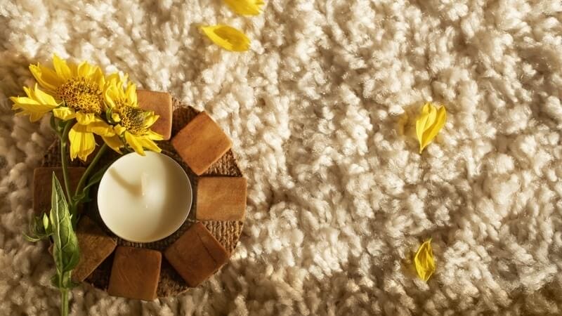 candle on carpet top view