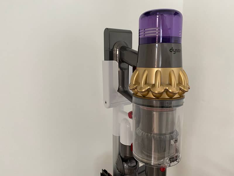 Clean Dyson vacuum propped against a wall