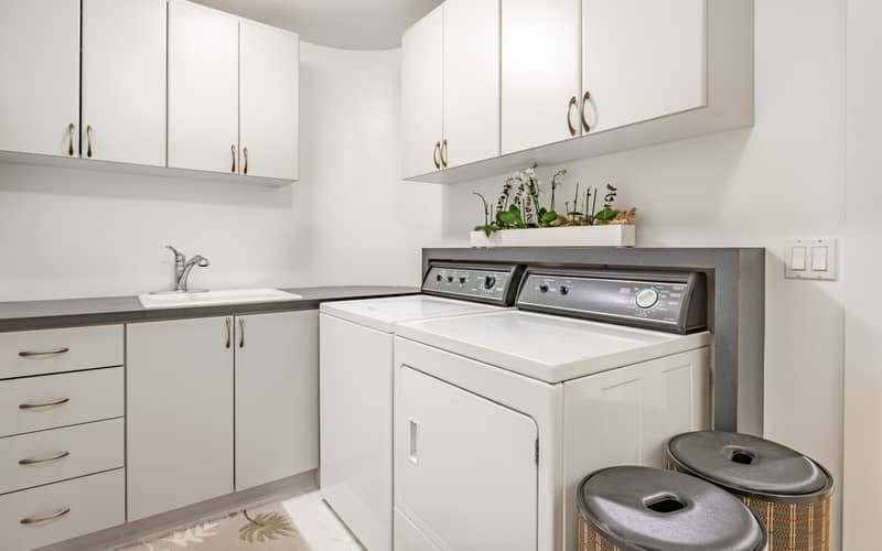 clean laundry room with top loader washer and dryer