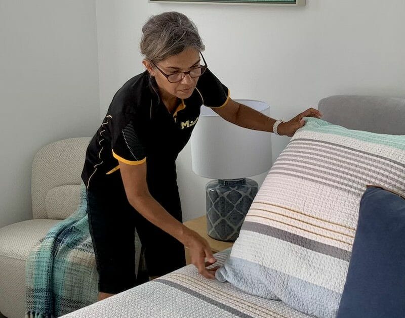 house cleaner making bed