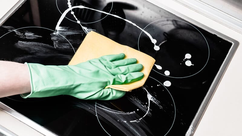 cleaning the cooktop surface with baking soda