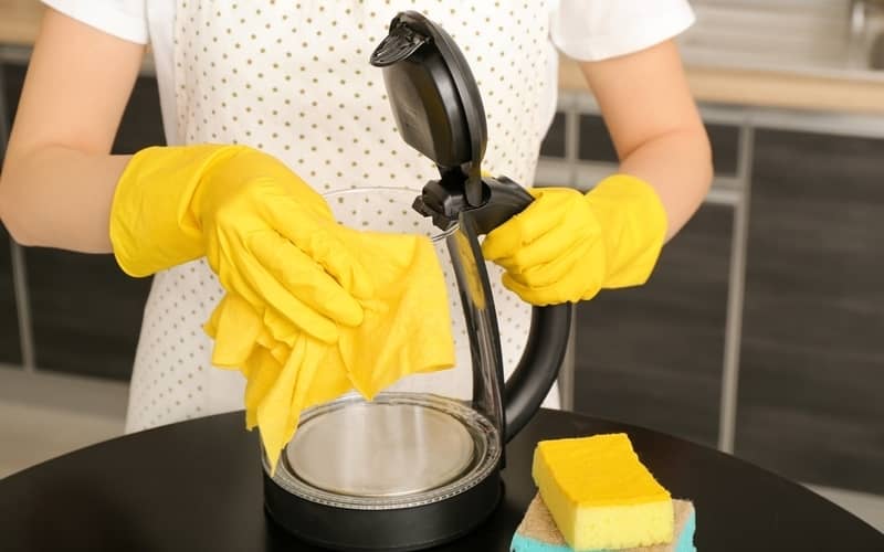 cleaning the outside of a glass kettle