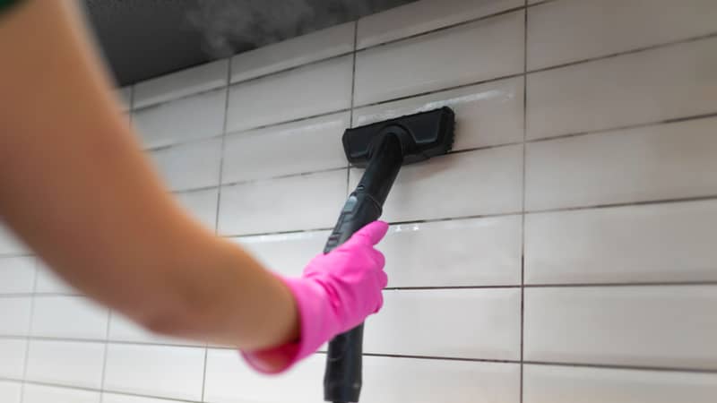 Cleaning tile grout with steam machine