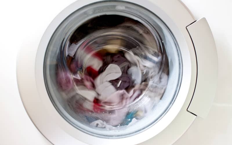 clothes spinning inside a front load washing machine