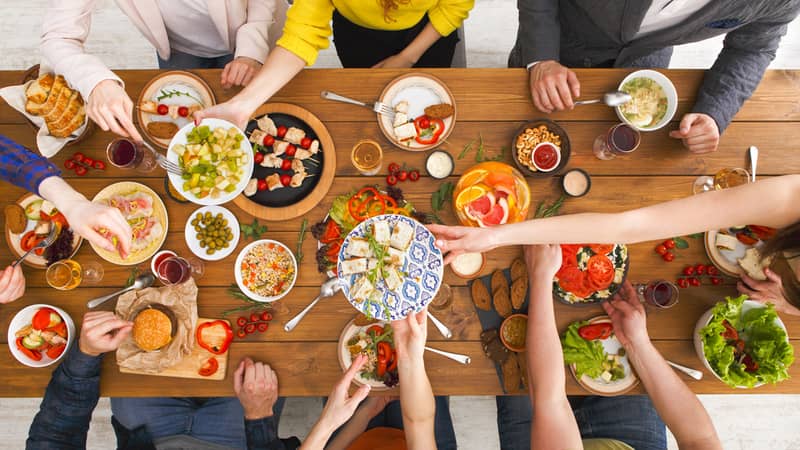 Friends dinner table top view.