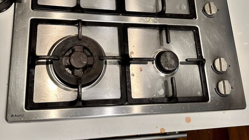 dirty black grates and stove top