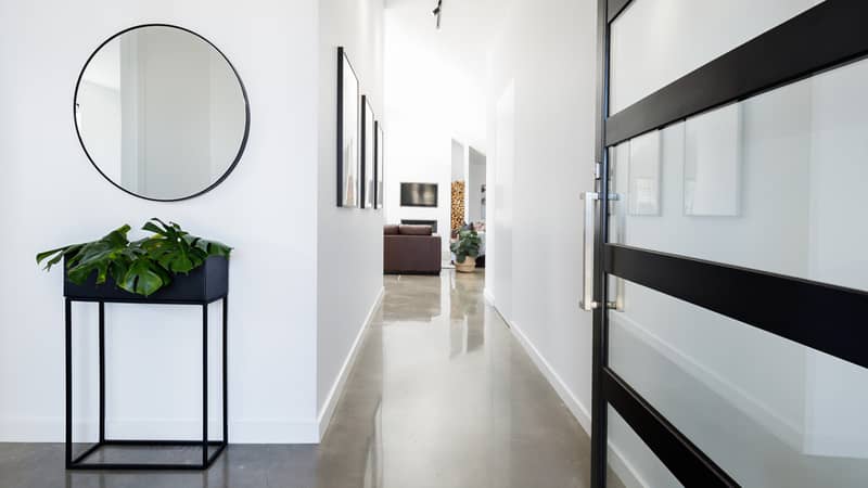 Contemporary home entry hall with polished concrete floors