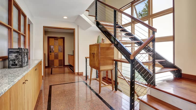 hallway with granite tile flooring