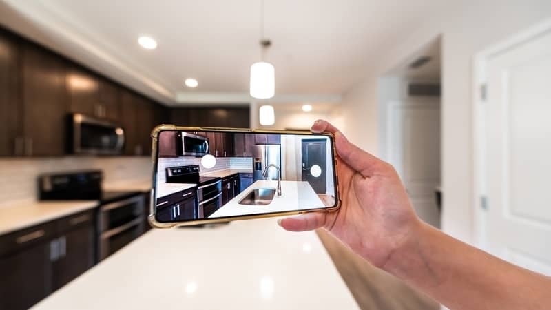 hand taking photo of a kitchen