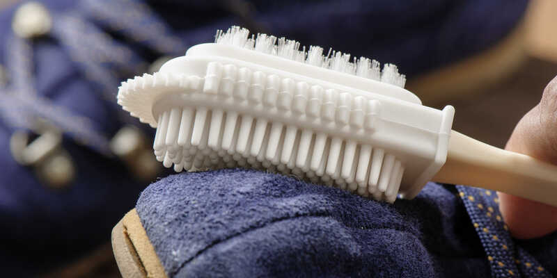 cleaning shoes with suede brush