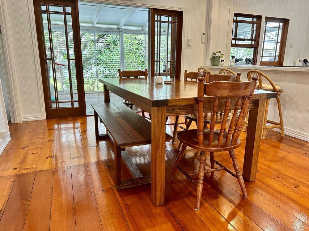 Polished timber flooring in the dining area with wooden table and chairs