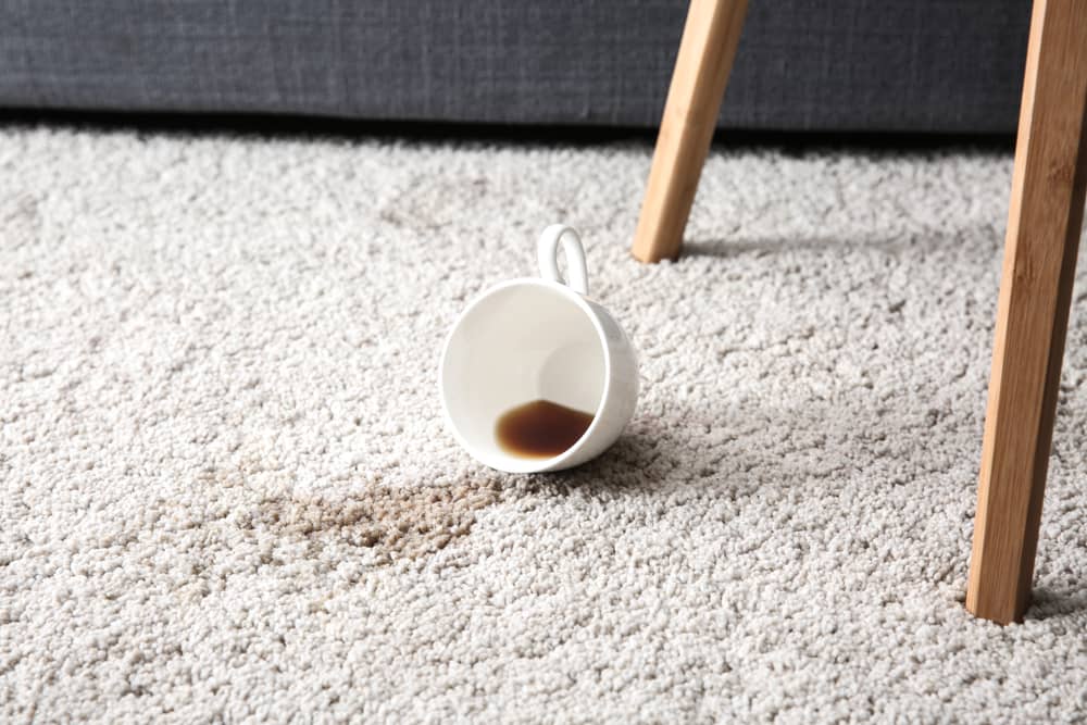 Cup of coffee spilled on carpet