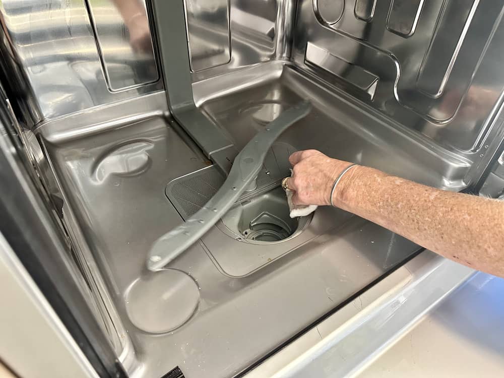 Hand cleaning dishwasher drain