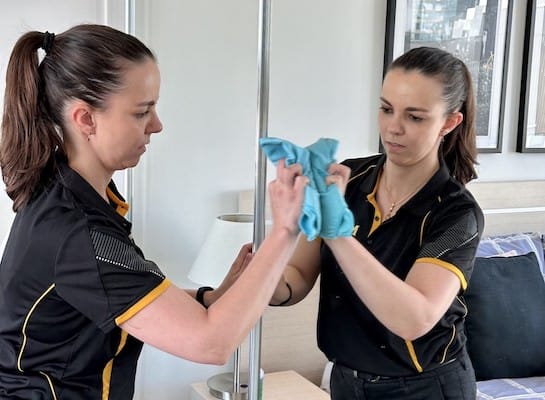 Adelaide house cleaner cleaning a bedroom mirror