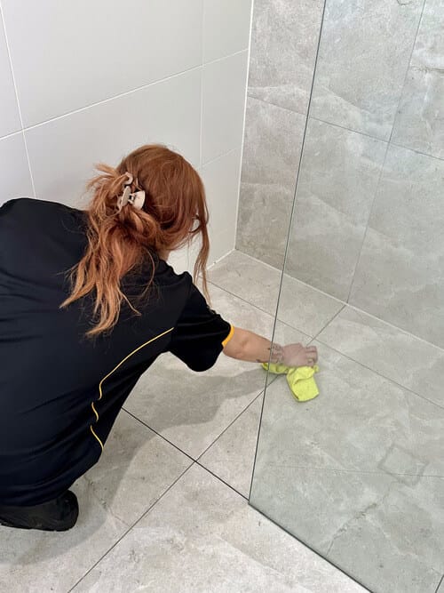 Maria cleaning shower floor tile grout