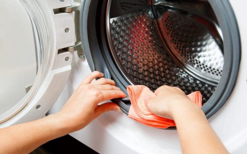 Close up of person's hands wiping dryer