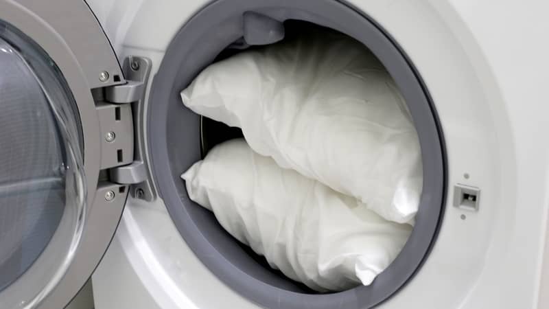 White pillow in washing machine.