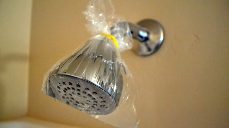 cleaning a shower head with vinegar