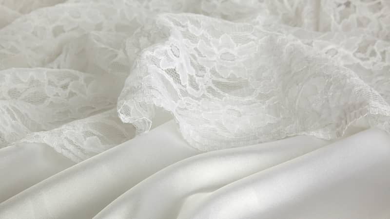 background of white silk and lace wedding dress