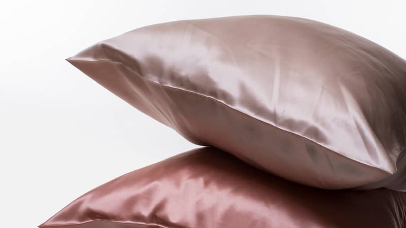 Two silk pillows on white background