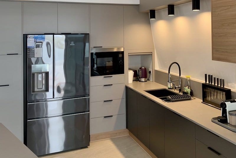 Clean stainless steel appliances in a modern kitchen