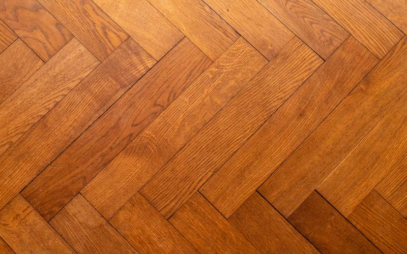 parquetry flooring in a herringbone pattern