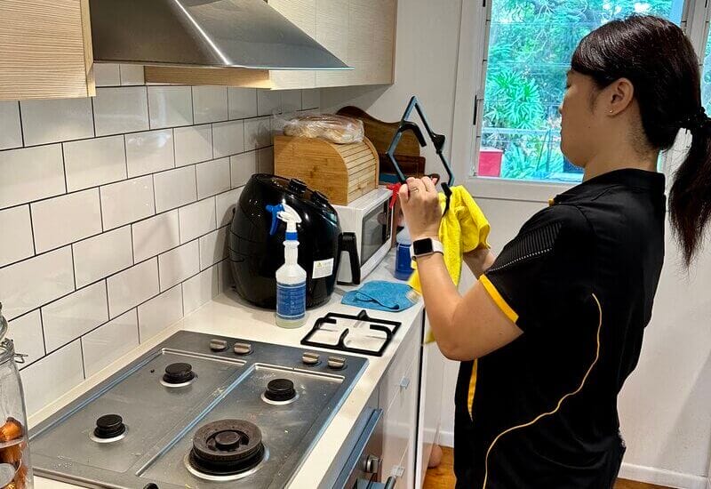 wiping down stove top grates when cleaning